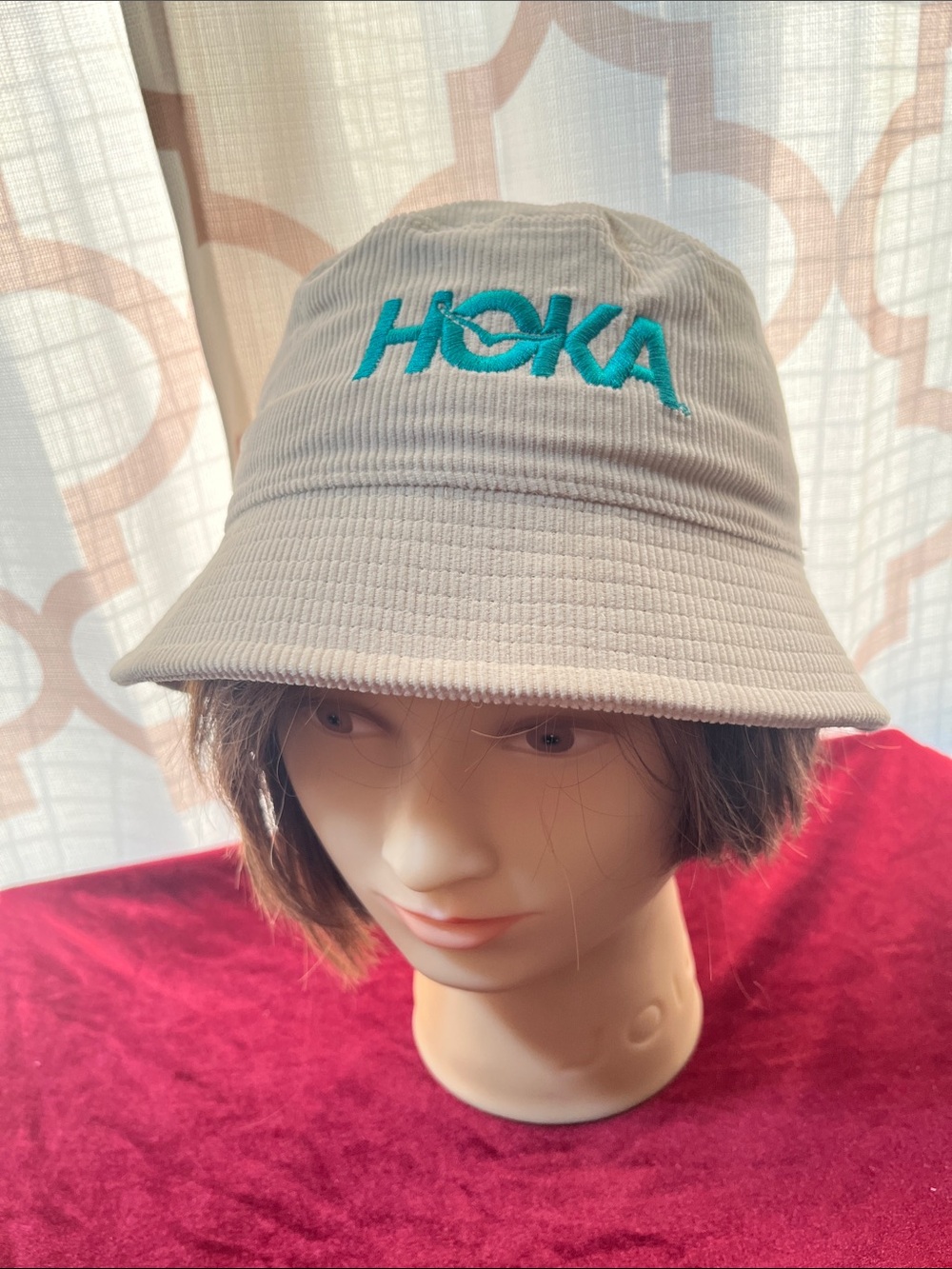Hoka Summer Mile Club beige Corduroy Bucket Hat with Teal Embroidered Logo.